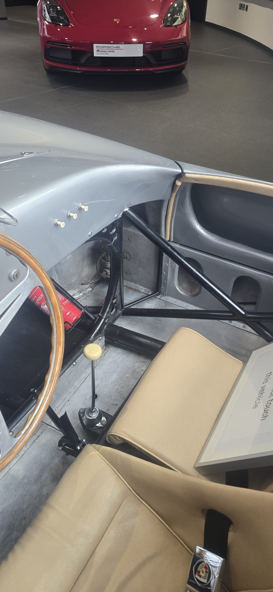 Stripped cockpit with yellow gear knob and red fire bottle